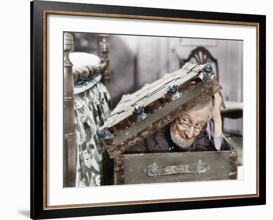 Man Peaking Out of a Trunk-null-Framed Photo