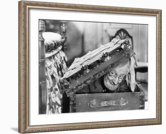 Man Peaking Out of a Trunk-null-Framed Photo