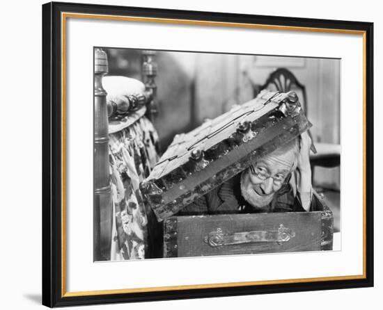 Man Peaking Out of a Trunk-null-Framed Photo