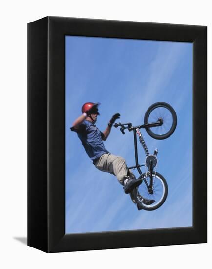 Man Performing Trick on a Bicycle-null-Framed Premier Image Canvas