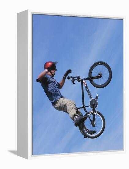 Man Performing Trick on a Bicycle-null-Framed Premier Image Canvas