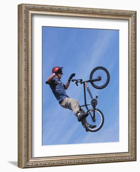 Man Performing Trick on a Bicycle-null-Framed Photographic Print