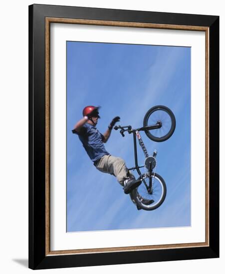 Man Performing Trick on a Bicycle-null-Framed Photographic Print