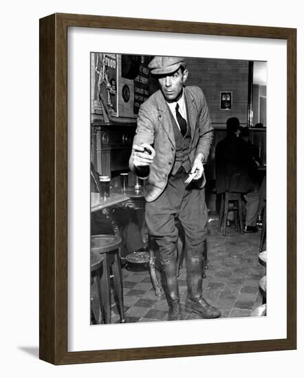Man Playing Quoits, Like Horse Shoes, in an English Pub-Hans Wild-Framed Photographic Print