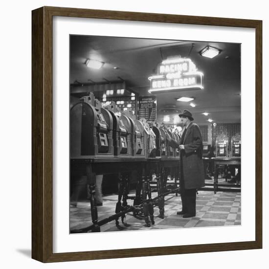 Man Playing the Slot Machines-Ralph Morse-Framed Photographic Print