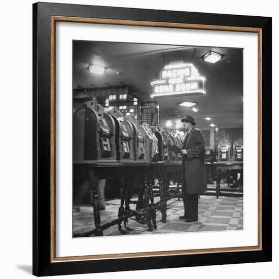 Man Playing the Slot Machines-Ralph Morse-Framed Photographic Print