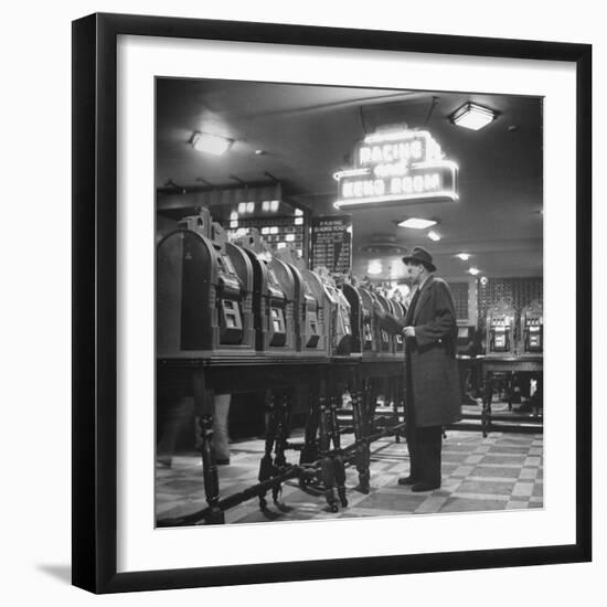 Man Playing the Slot Machines-Ralph Morse-Framed Photographic Print