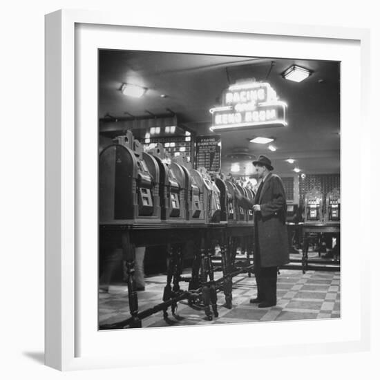 Man Playing the Slot Machines-Ralph Morse-Framed Photographic Print