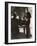 Man Plays a Piano and Looks up at a Glamorous Woman in a Long Dress-null-Framed Photographic Print