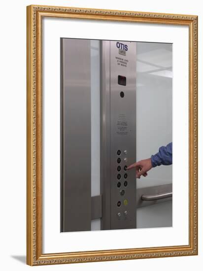 Man Pressing Lift Buttons, UK Office Interior-Richard Bryant-Framed Photo