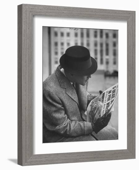 Man Reading a Newspaper While Wearing a Fedora Hat with a Flattened Top and Slim Brim-Ralph Morse-Framed Photographic Print