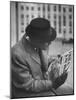 Man Reading a Newspaper While Wearing a Fedora Hat with a Flattened Top and Slim Brim-Ralph Morse-Mounted Photographic Print