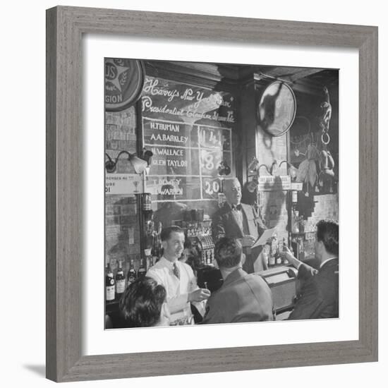 Man Reading About Election Straw Votes at Harry's New York Bar-Yale Joel-Framed Photographic Print