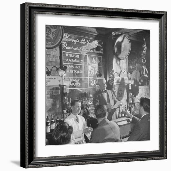 Man Reading About Election Straw Votes at Harry's New York Bar-Yale Joel-Framed Photographic Print