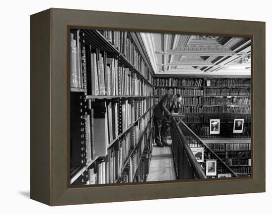 Man Reading Book Among Shelves on Balcony in New York Public Library-Alfred Eisenstaedt-Framed Premier Image Canvas