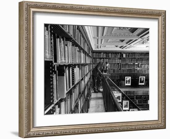 Man Reading Book Among Shelves on Balcony in New York Public Library-Alfred Eisenstaedt-Framed Photographic Print