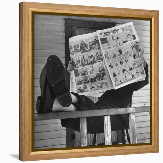 Man Reading the Comics Section of the Detroit Times on a Typical Sunday During WWII-Walter Sanders-Framed Premier Image Canvas