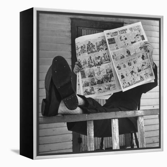 Man Reading the Comics Section of the Detroit Times on a Typical Sunday During WWII-Walter Sanders-Framed Premier Image Canvas