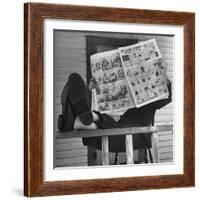 Man Reading the Comics Section of the Detroit Times on a Typical Sunday During WWII-Walter Sanders-Framed Photographic Print