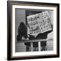 Man Reading the Comics Section of the Detroit Times on a Typical Sunday During WWII-Walter Sanders-Framed Photographic Print