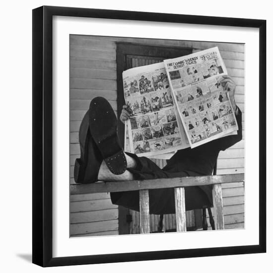 Man Reading the Comics Section of the Detroit Times on a Typical Sunday During WWII-Walter Sanders-Framed Photographic Print