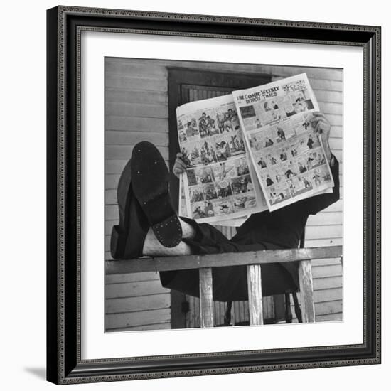 Man Reading the Comics Section of the Detroit Times on a Typical Sunday During WWII-Walter Sanders-Framed Photographic Print