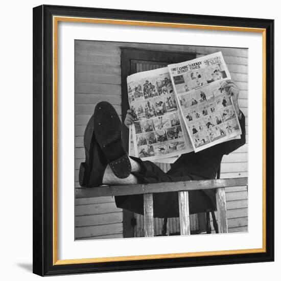 Man Reading the Comics Section of the Detroit Times on a Typical Sunday During WWII-Walter Sanders-Framed Photographic Print