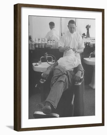Man Receiving a Shave in a Barber Shop-Cornell Capa-Framed Photographic Print