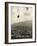 Man Riding Chair Lift Above Town-Jerry Cooke-Framed Photographic Print