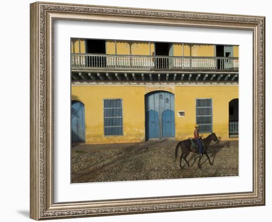 Man Riding Horse Past the Galeria Del Arte (Art Gallery), Plaza Mayor, Trinidad, Cuba-Eitan Simanor-Framed Photographic Print