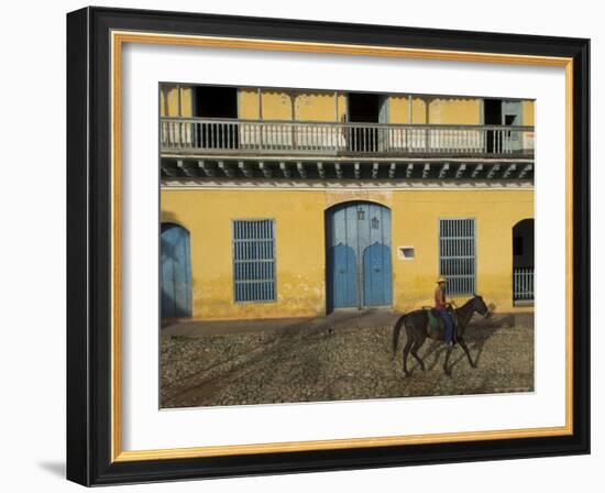 Man Riding Horse Past the Galeria Del Arte (Art Gallery), Plaza Mayor, Trinidad, Cuba-Eitan Simanor-Framed Photographic Print