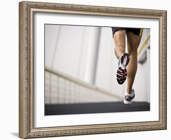 Man Running across a Bridge, United Arab Emirates-Julian Love-Framed Photographic Print