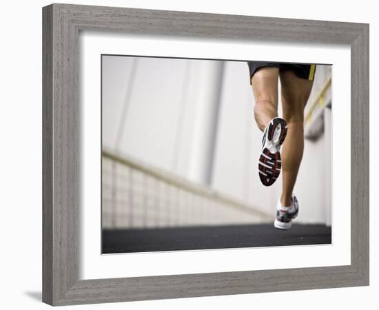 Man Running across a Bridge, United Arab Emirates-Julian Love-Framed Photographic Print