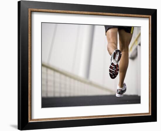 Man Running across a Bridge, United Arab Emirates-Julian Love-Framed Photographic Print