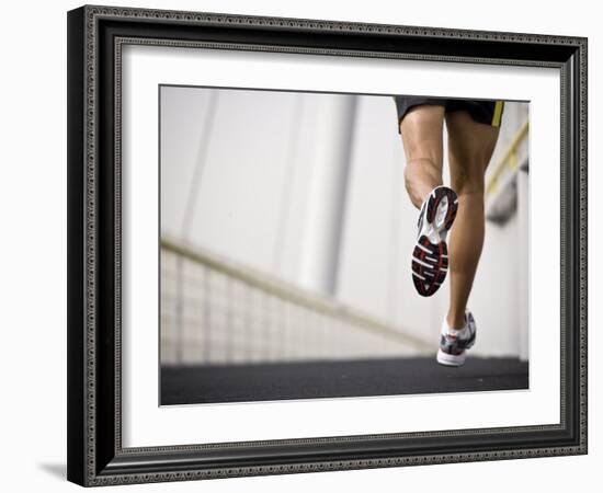 Man Running across a Bridge, United Arab Emirates-Julian Love-Framed Photographic Print