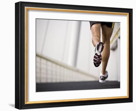 Man Running across a Bridge, United Arab Emirates-Julian Love-Framed Photographic Print