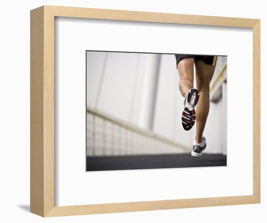 Man Running across a Bridge, United Arab Emirates-Julian Love-Framed Photographic Print