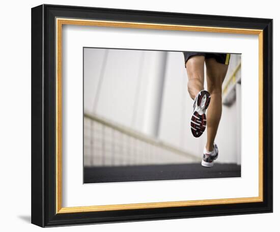 Man Running across a Bridge, United Arab Emirates-Julian Love-Framed Photographic Print