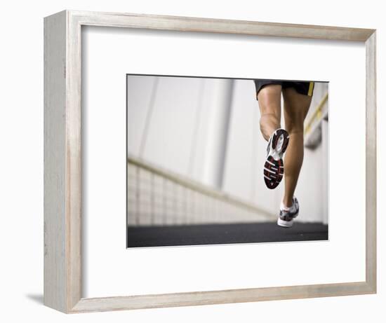 Man Running across a Bridge, United Arab Emirates-Julian Love-Framed Photographic Print
