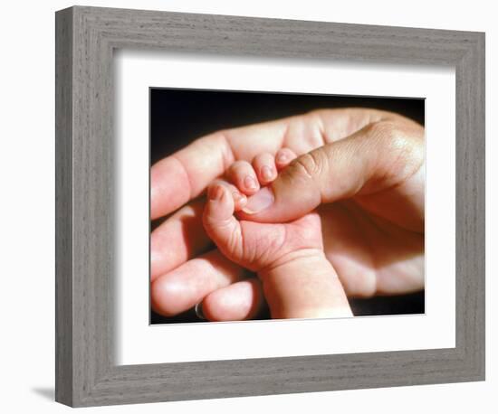 Man's Hand Holding Baby's Hand-Mitch Diamond-Framed Photographic Print