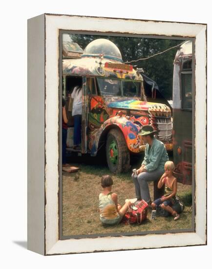 Man Seated with Two Young Boys in Front of a Wildly Painted School Bus, Woodstock Music Art Fest-John Dominis-Framed Premier Image Canvas