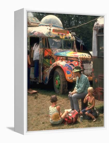 Man Seated with Two Young Boys in Front of a Wildly Painted School Bus, Woodstock Music Art Fest-John Dominis-Framed Premier Image Canvas