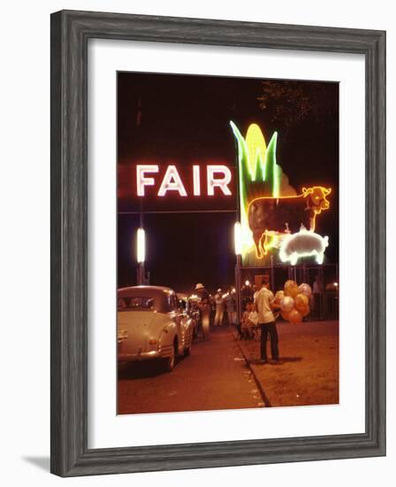 Man Selling Balloons at Entrance of Iowa State Fair-John Dominis-Framed Photographic Print