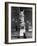 Man Sitting Beneath Statue of Giambologna's "Rape of the Sabine" in Loggia Dei Lanzi-Carl Mydans-Framed Photographic Print