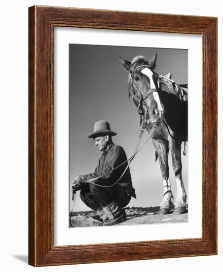 Man Sitting Holding His Horses Reins-Loomis Dean-Framed Photographic Print