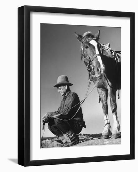 Man Sitting Holding His Horses Reins-Loomis Dean-Framed Photographic Print