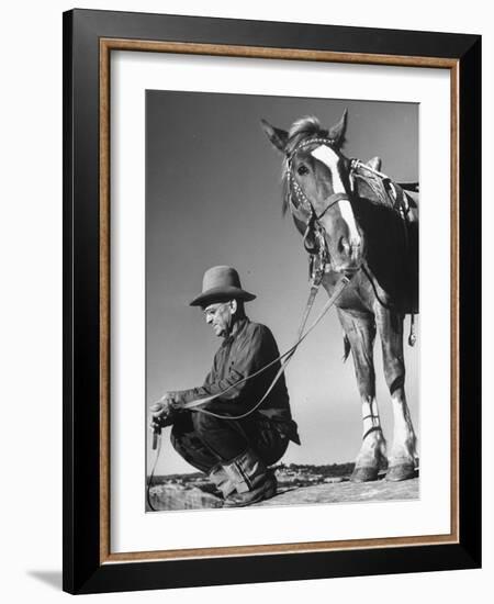 Man Sitting Holding His Horses Reins-Loomis Dean-Framed Photographic Print