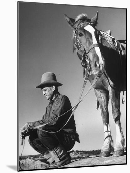 Man Sitting Holding His Horses Reins-Loomis Dean-Mounted Photographic Print