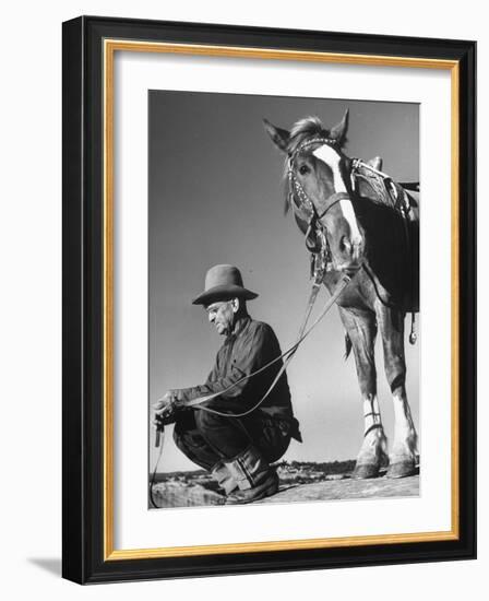 Man Sitting Holding His Horses Reins-Loomis Dean-Framed Photographic Print