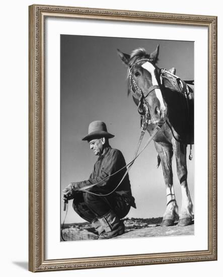 Man Sitting Holding His Horses Reins-Loomis Dean-Framed Photographic Print